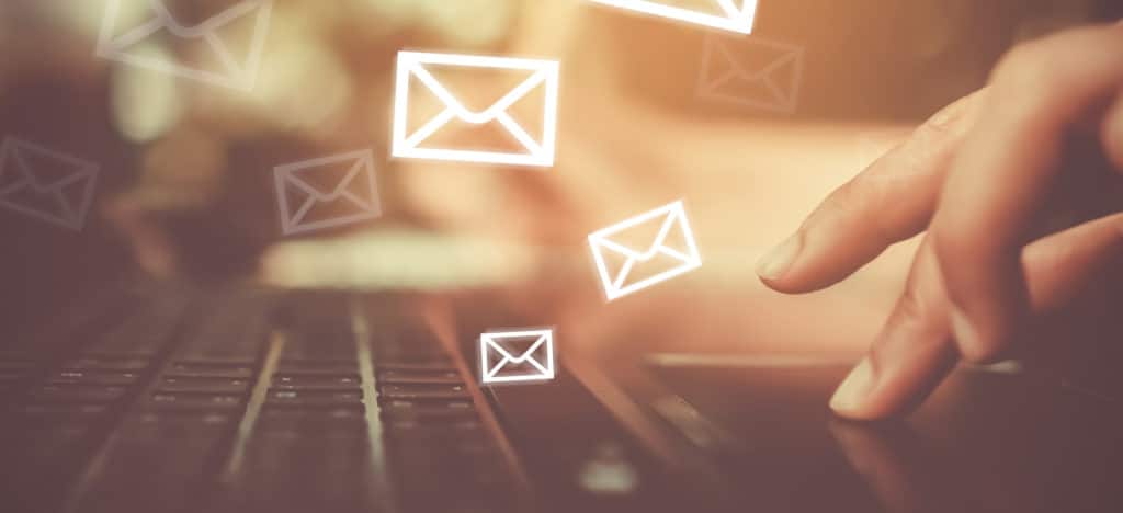 10 Things to Consider when Looking for an Email Service featured photo keyboard with email envelope icons
