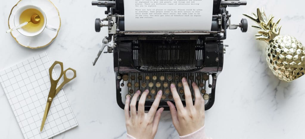 What is NaNoWriMo featured image typing on typewriter