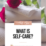 What is self-care? Blog title over roses laying on top of a pile of white towels